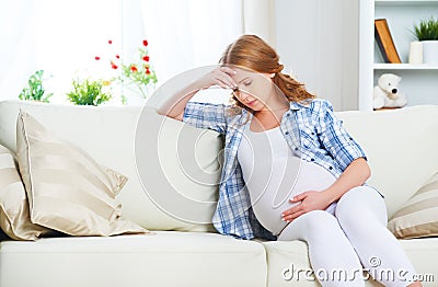 Pregnant woman with headache and pain Stock Photo