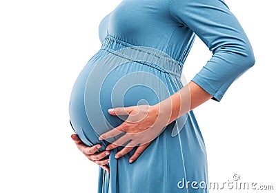 Pregnant woman hold hands on belly. Close-up. Stock Photo