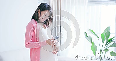 Pregnant woman hold picture Stock Photo