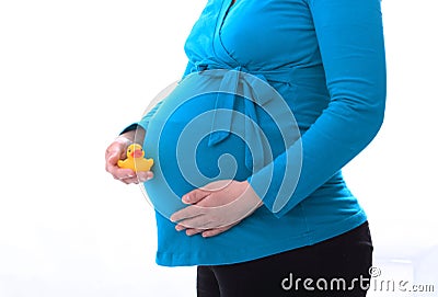 Pregnant woman holding toy in hand Stock Photo