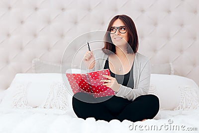 Pregnant Woman Keeping a Pregnancy Diary Journal Stock Photo