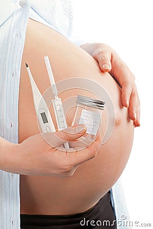 Pregnant woman with medical equipment Stock Photo
