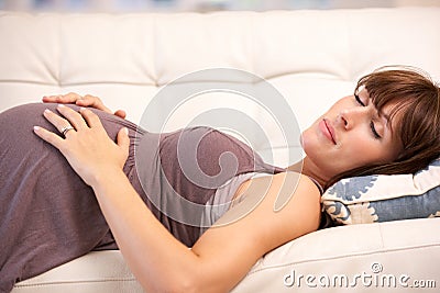 Pregnant woman resting at home