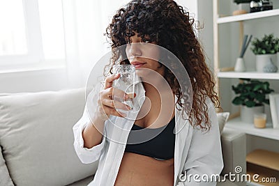 Pregnant woman smile and happiness taking pills and vitamins for pregnant women with pills hand water drinks clean water Stock Photo