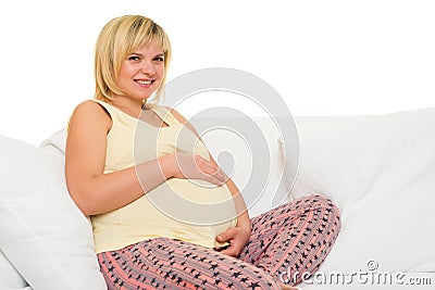 Pregnant woman on sofa Stock Photo