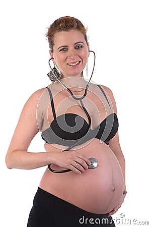 Pregnant woman with stetoscope Stock Photo