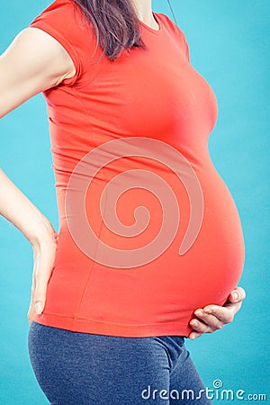 Pregnant woman with stomach or back pain, health care and aches in pregnancy, risk of miscarriage Stock Photo