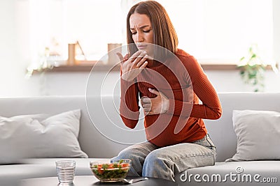 Pregnant Woman Suffering From Toxicosis Having Nausea During Lunch Indoor Stock Photo