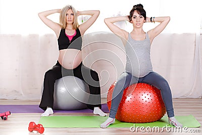 Pregnant women with large gymnastic balls Stock Photo