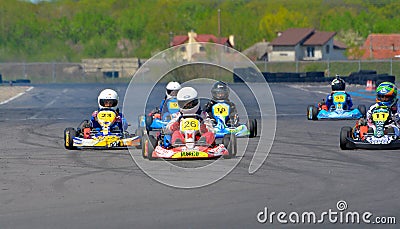 PREJMER, BRASOV, ROMANIA - MAY 3: Unknown pilots competing in National Karting Championship Dunlop 2015, on May 3, 2015 in Editorial Stock Photo