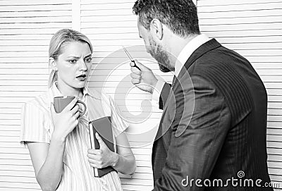 Prejudice and personal attitude to employee. Tense conversation or quarrel between colleagues. Boss discriminate female Stock Photo