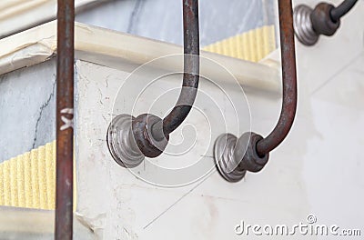 preliminary installation of decorative fasteners of metal handrails to steps Stock Photo