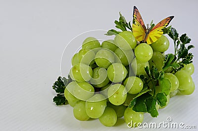 Premium fresh shine mascat grape and batterfly on white background Stock Photo
