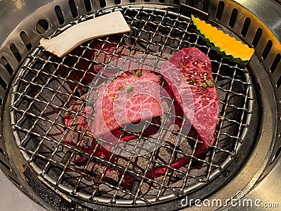 Premium A5 Japanese wagyu beef for barbecue or yakinuku on charcoal grill Stock Photo