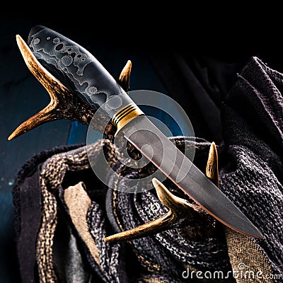 Premium knife. Legendary hunting knife. Hunting knife and antler Stock Photo