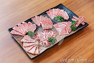 Premium Rare Slices many parts of Wagyu A5 beef with high-marbled texture on stone plate served for Yakiniku. Stock Photo