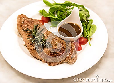 Premium ribeye steak on a well decorated dish Stock Photo