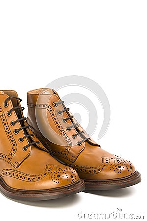 Premium Tanned Brogue Derby Boots Made of Calf Leather with Rubber Sole Stock Photo
