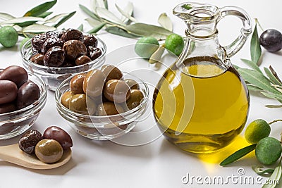 Premium virgin olive oli and variety of olives. Stock Photo