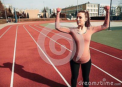 Prenatal exercises. Prenatal healthy fitness active fit gym outside. Pregnant woman training yoga sport exercise Stock Photo