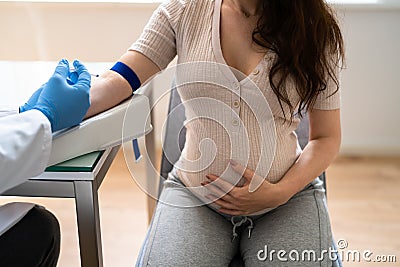 Prenatal Screening. Doctor Drawing Blood Sample Stock Photo