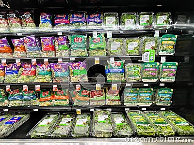 Prepacked variety of lettuce for sale at a grocery store in Simpsonville, SC Editorial Stock Photo