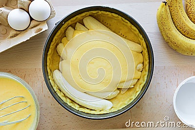 Preparation banana cake cheesecake making from ingredients on wooden table background. Flat lay. Top view Stock Photo