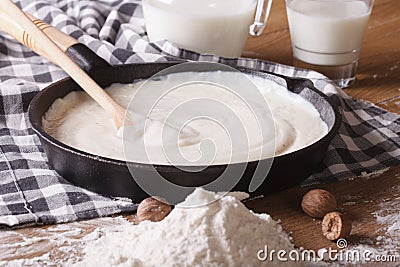 Preparation of bechamel sauce in a pan, horizontal Stock Photo