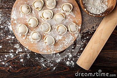 Preparation dumplings on wooden board. Stock Photo