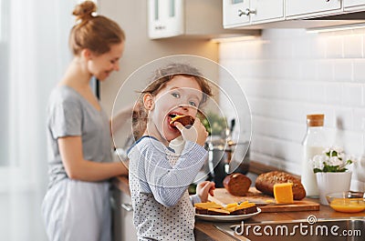 Preparation of family breakfast. mother and child daughter cook Stock Photo