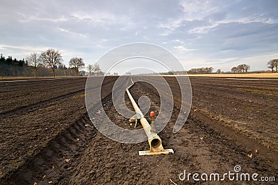 Pipe for sprinkler system in flower beds Stock Photo