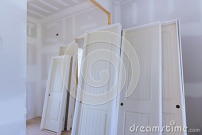 Preparation for installation of the stacker interior wooden doors for a new home as waiting for them Stock Photo