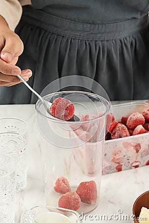 Preparation Making Strawberry Juice or Slushy with Frozen Strawberry Stock Photo