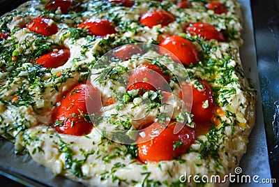 Preparation of raw dough for ciabattna with fresh pieces of red pardons, green dill and garlic. Stock Photo