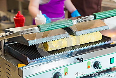 Preparation of shawarma on an electric furnace. Stock Photo