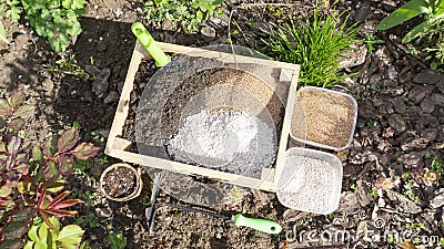 Preparation of the soil mixture from vermicompost, biohumus , vermiculite and agroperlite for transplanting seedlings and planting Stock Photo