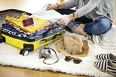 Preparation travel suitcase at home Stock Photo