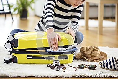 Preparation travel suitcase at home Stock Photo