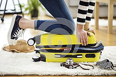 Preparation travel suitcase at home Stock Photo