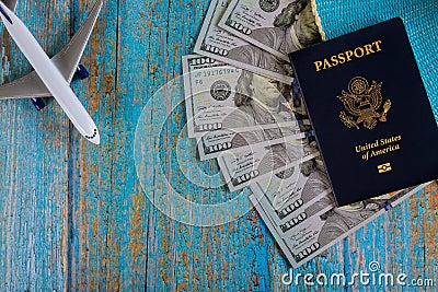 Preparation traveling of airplane on U.S. dollar bills for travel with USA passport Stock Photo