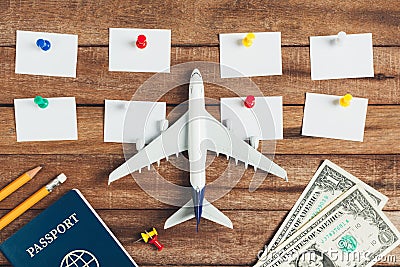 Preparation for Traveling concept and to do list, the paper noted, pencil, money, passport, airplane, colorful push pin. Stock Photo