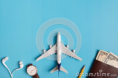 Preparation for Traveling concept, watch, airplane, money, passport, pencils, book. Stock Photo