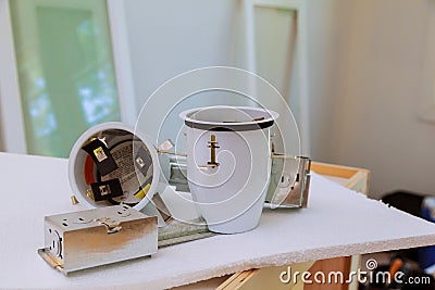 Preparations for ceiling installation electric lamp Stock Photo