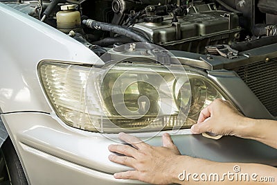 Prepare Headlight lenses for Polish Restorer, Car maintenance service Stock Photo