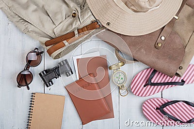 Prepare for journey in africa style - accessories and travel items, packing clothes in backpack: backpack, hat, passport, flip Stock Photo