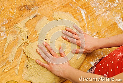 Prepare meal food. modelling dough in a table Stock Photo
