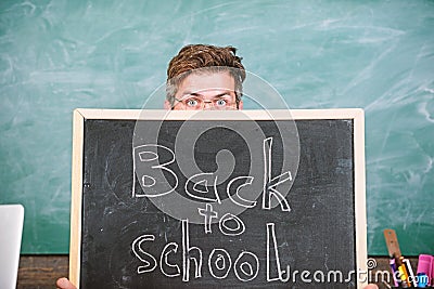 Prepare school year. Are you ready study. Teacher or school principal welcomes inscription back to school. Teacher Stock Photo