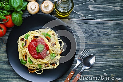 Prepared spaghetti pasta with tomato sauce, roasted champignons Stock Photo