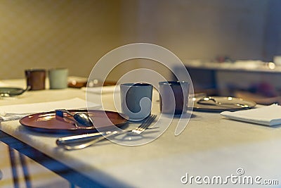 Prepared table without people to eat with warm background in restaurant Stock Photo