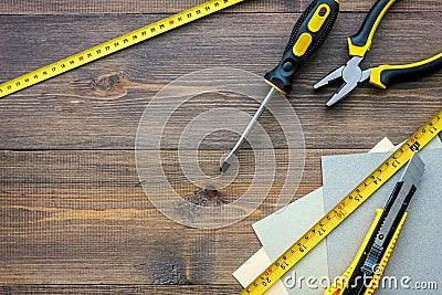 Preparing for appartment repair. Set of construction tools on wooden table background top view copyspace Stock Photo